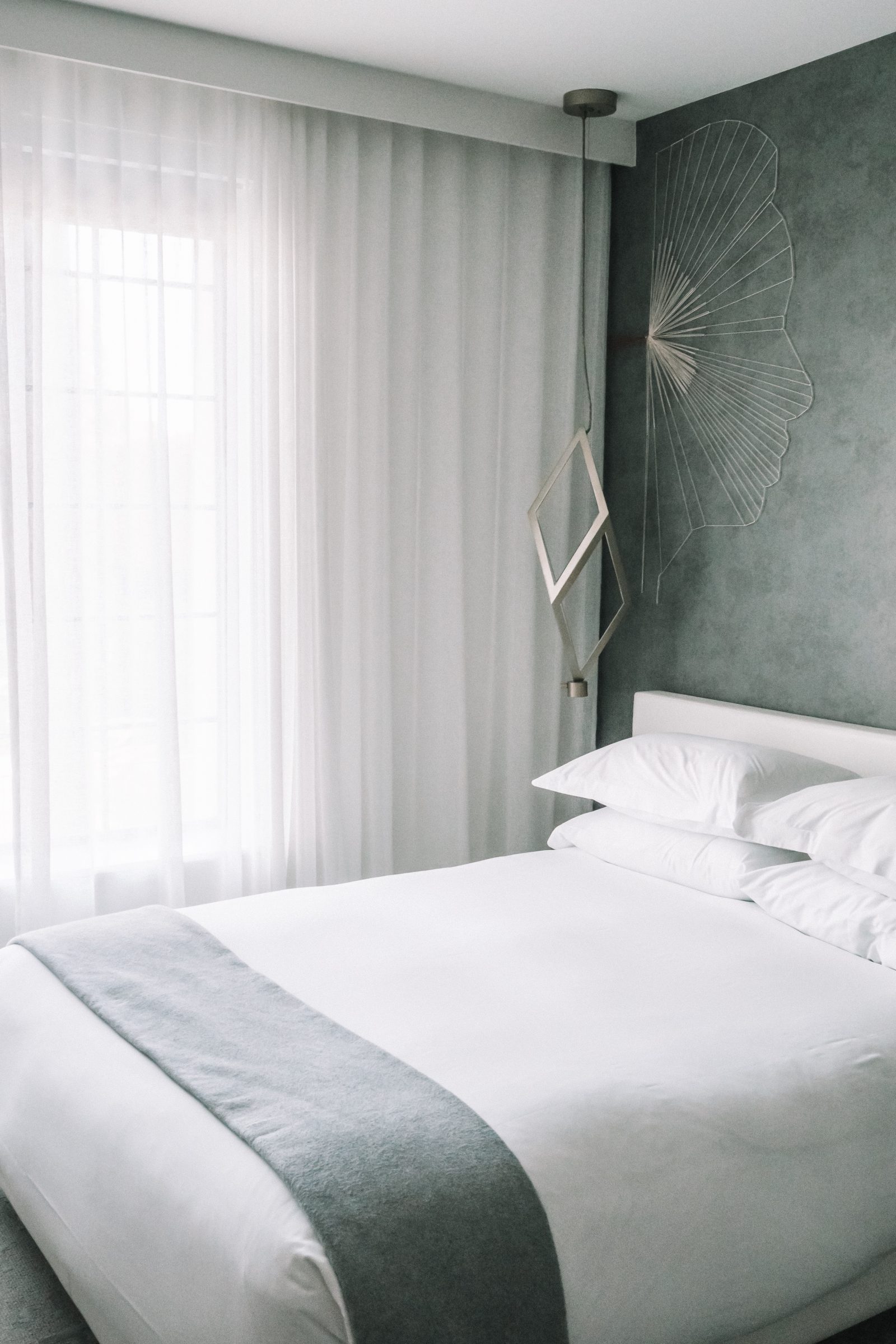 Clean white sheets in a modern hotel room at the Kimton La Peer Hotel in West Hollywood