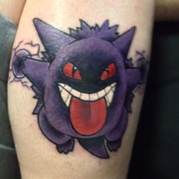 Tattoo of Pokemon character "Gengar" on a man's calf