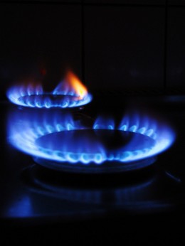 Photo of a lit, gas hob.
