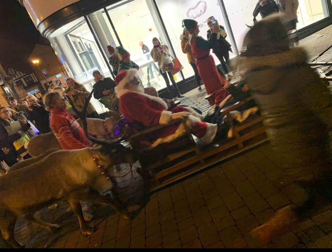 Santa rides past with the reindeers. Photo credit: Bethany Lee