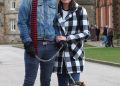 Couple pose for picture with their dog