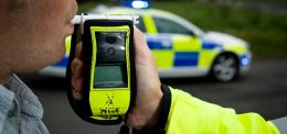 Officer giving a breathalyser test 