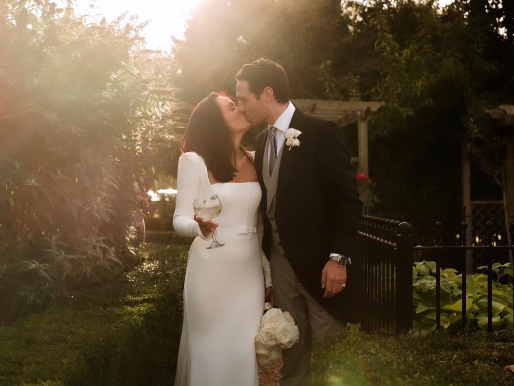 Photography  by Jonathan Flint photography. Sophie and Freddie sharing a kiss.