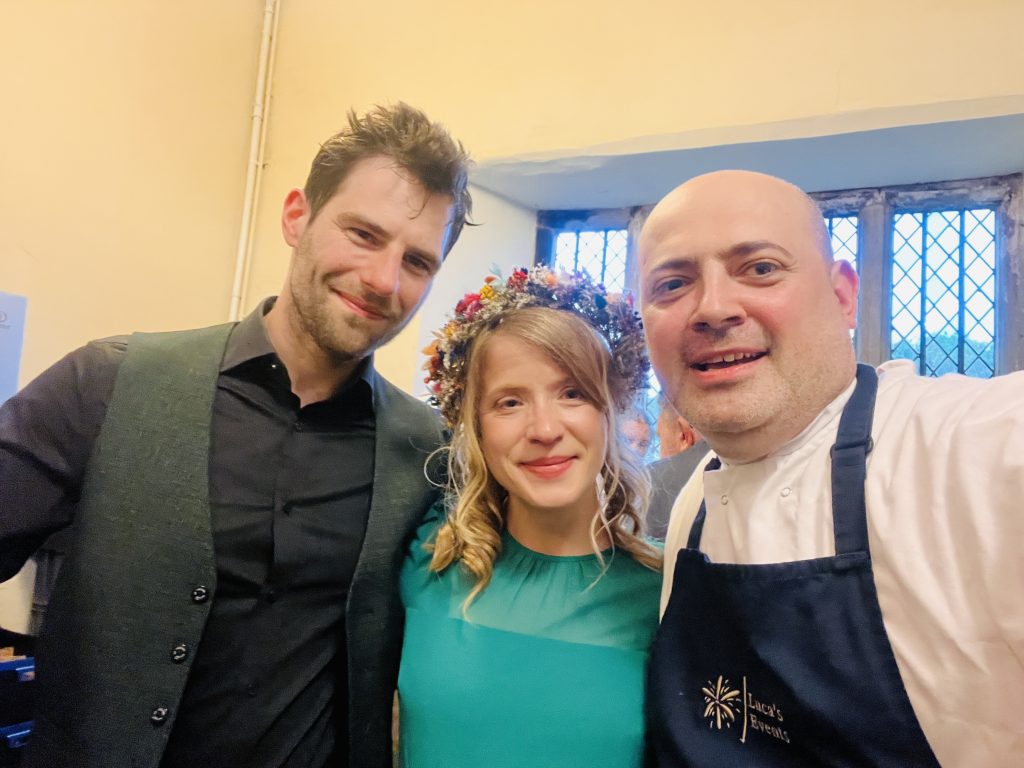 A photo of the bride - Anna, and Tom - the groom, pictured with Luca's Events Chef Owner, Laur.