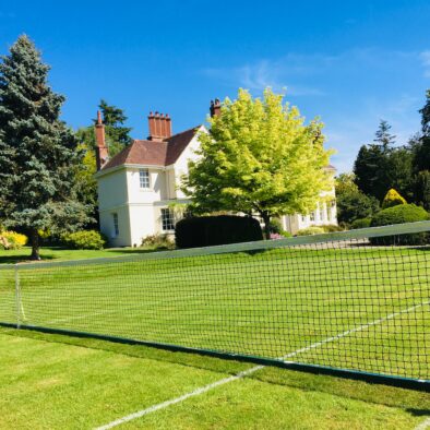 Summer tennis lawn at Ludlow Manor House