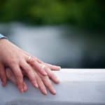 two hands on gray surface