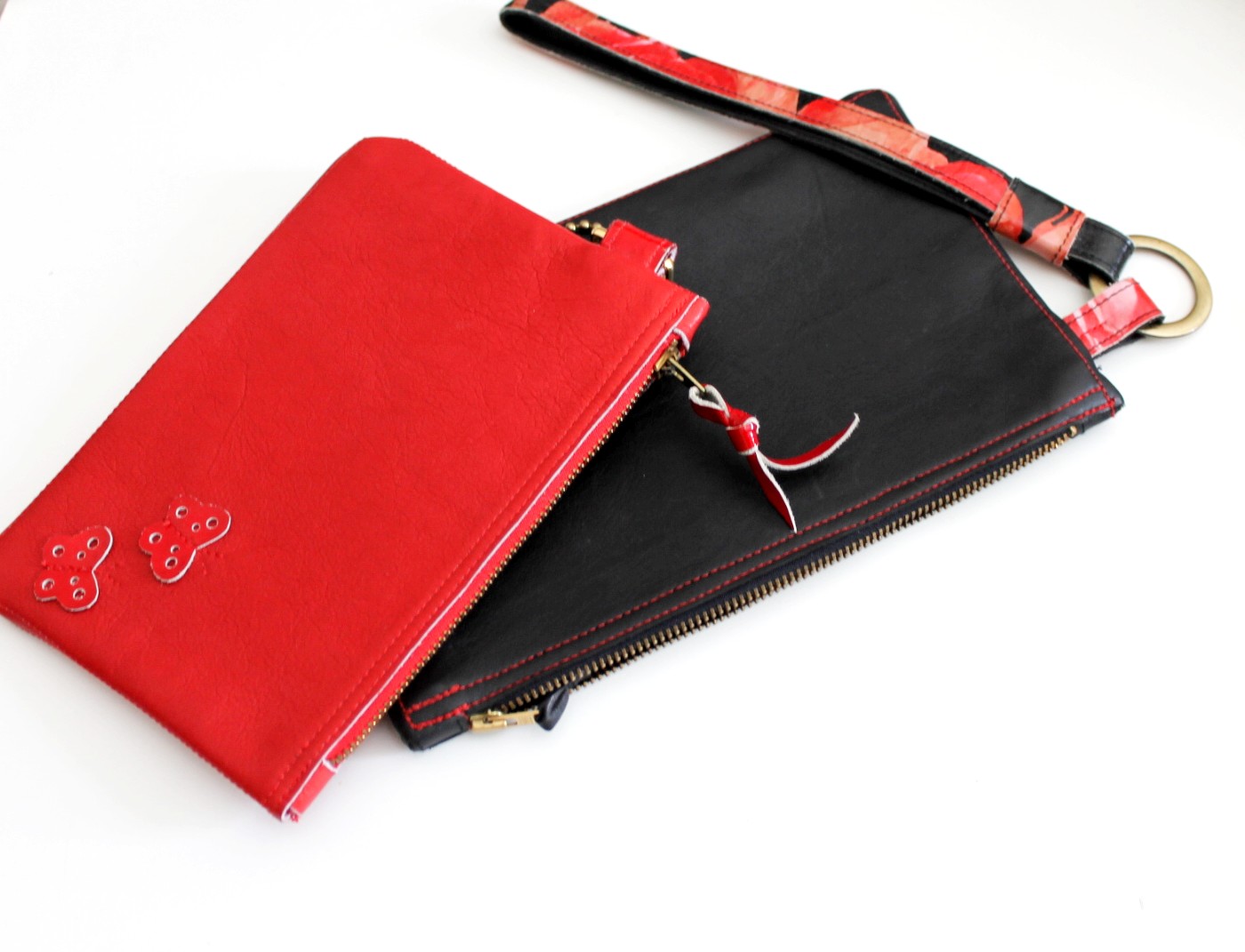Sort & rød clutch taske i skind - Nedsat vare - Oprydning