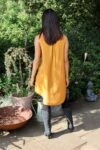 Long sleeveless yellow shirt with a loose fit 