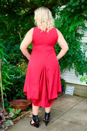 The back of a red balloon dress with big pockets