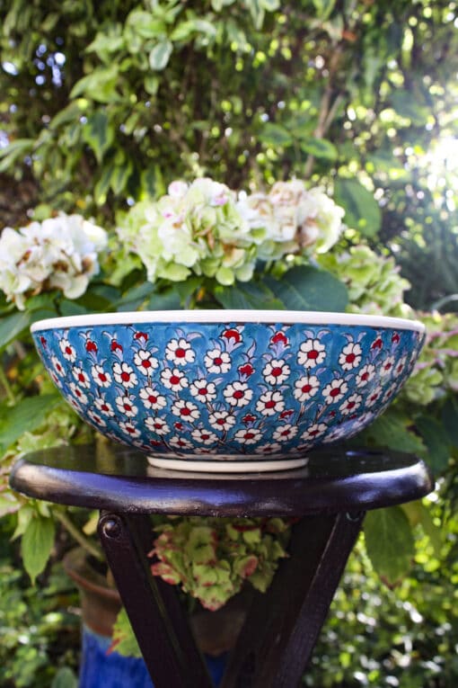 Handmade Turkish bowl in colorful ceramics with the tree of life in blue, turquise, red and white colors