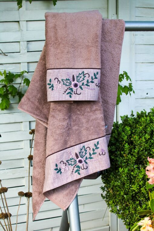 Luxurious organic towel set in dusty rose with handmade floral embroidery at the border