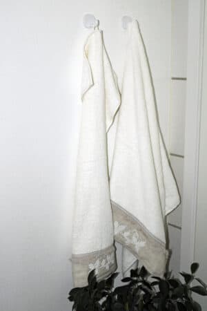 Elegant white and beige towel set with beautiful decorative details