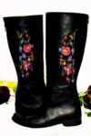 Black leather boots with floral embroidery on the sides