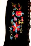 Floral embroidery on black suede boots