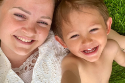 Mamabel and son earthing in grass