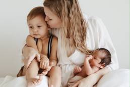 mother_holding_kissing_children