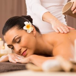 woman-having-back-oil-massage-less