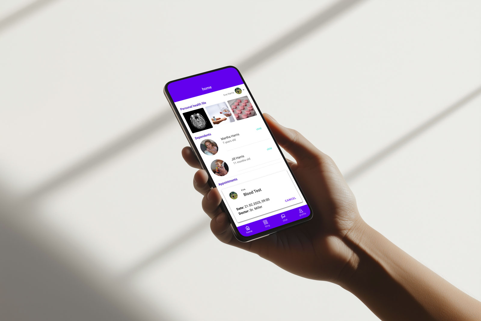 a hand holding a smartphone with the FDA app open