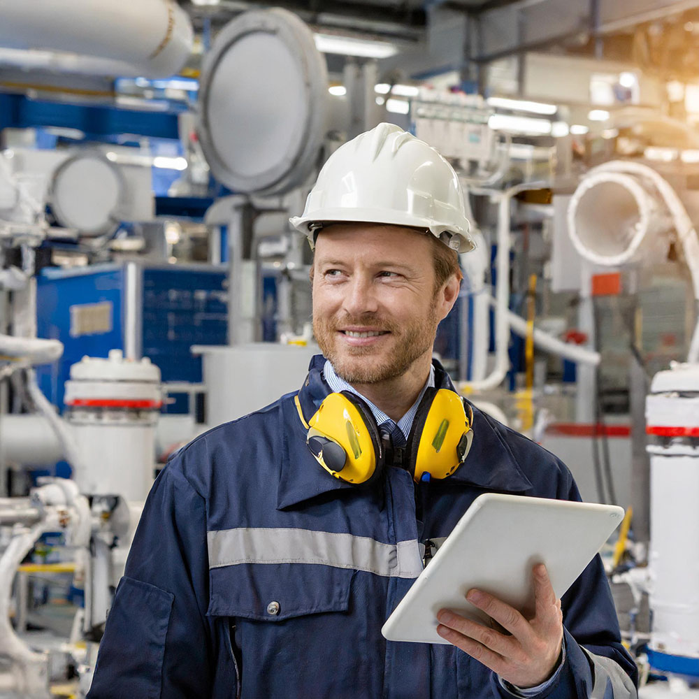 An AI generated image of a man in a ship machine room holding a tablet