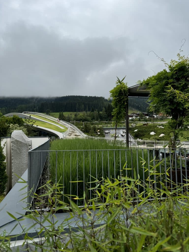 View from the terrace of the Krallerhof hotel towards Atmosphere the new wellness area, in cloudy weather