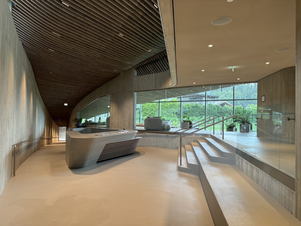 Bali desk at the entrance to Atmosphere with a view of the rest room downstairs in the back