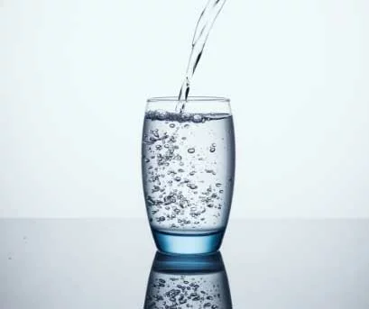 Refreshing water being poured into a glass