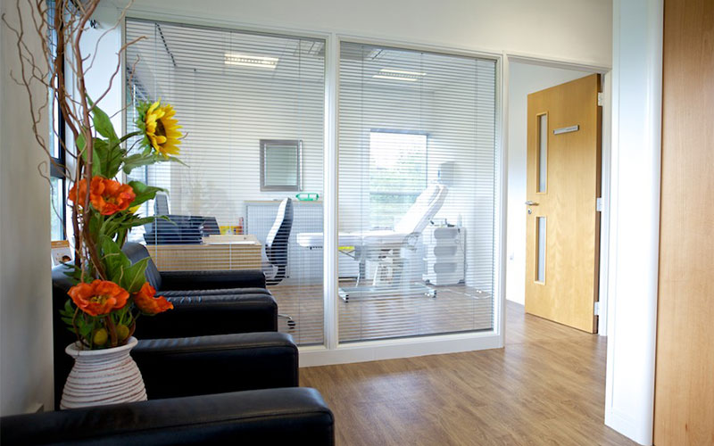 Double glazed office partition with integral blinds.