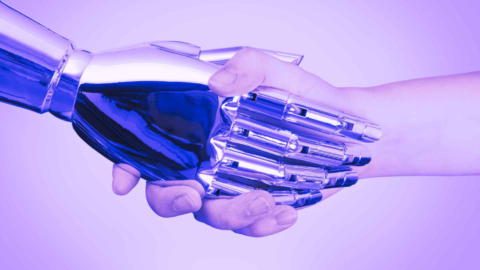Menneskehånden og robotten samarbejder, forener teknologi og menneskelig kreativitet.