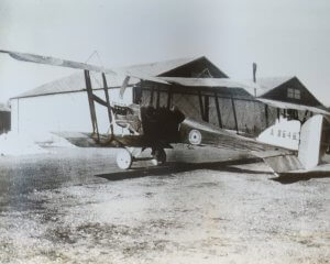 a black and white photo of an old airplane