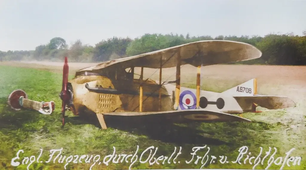 an old airplane sitting in the middle of a field