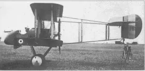 an old photo of a small airplane in the grass