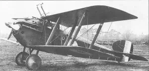 an old airplane is parked on the grass