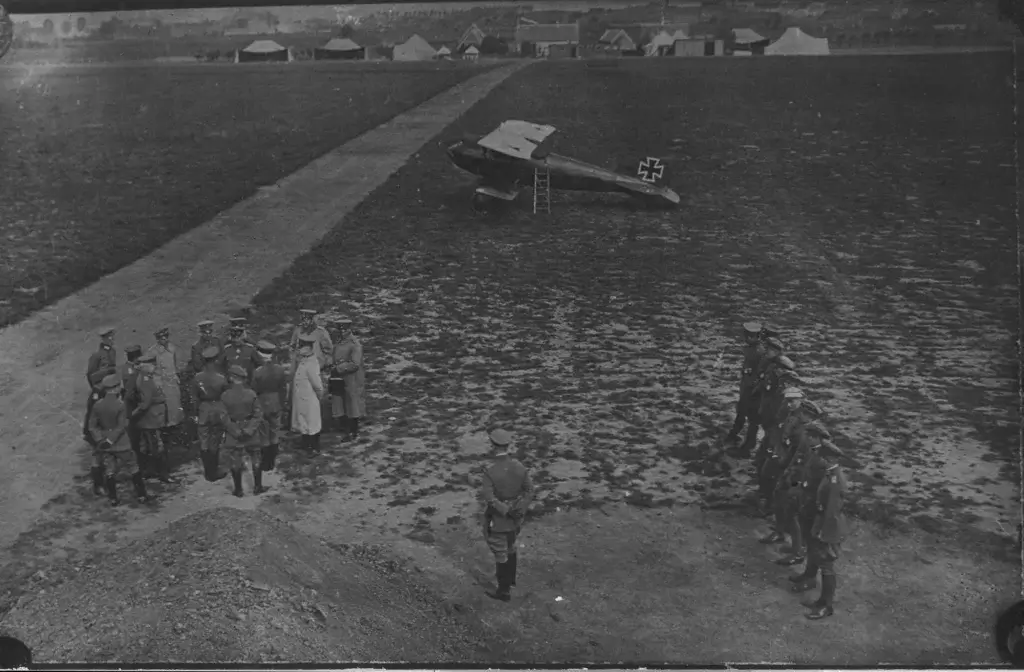 a group of men standing next to each other near an airplane