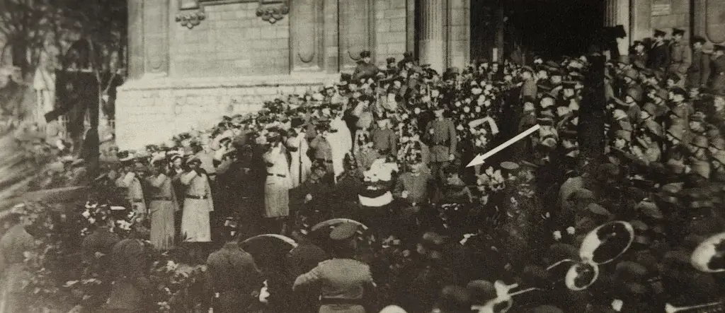 a crowd of people standing in front of a building