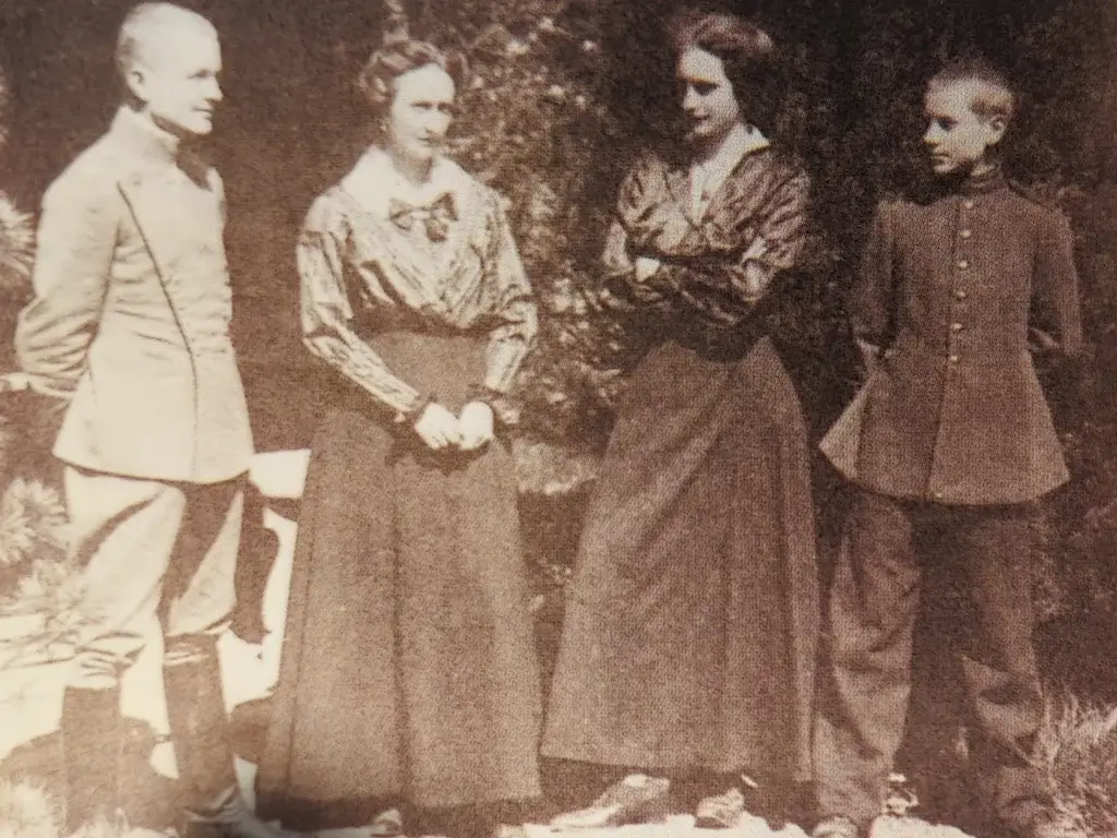 an old black and white photo of three people standing next to each other