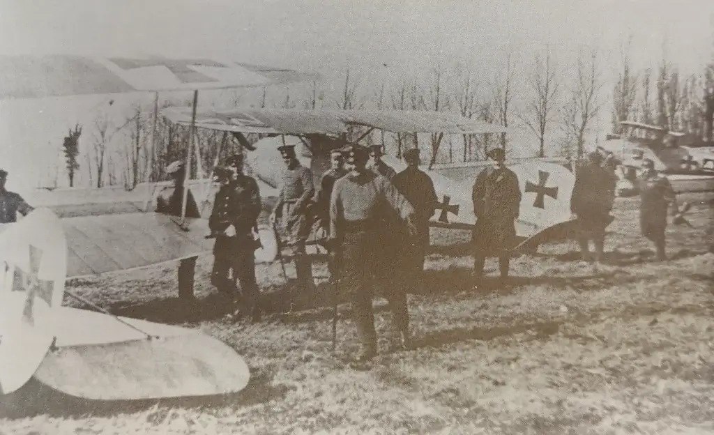 a group of people standing around an airplane