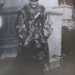 an old black and white photo of a man in a fur coat