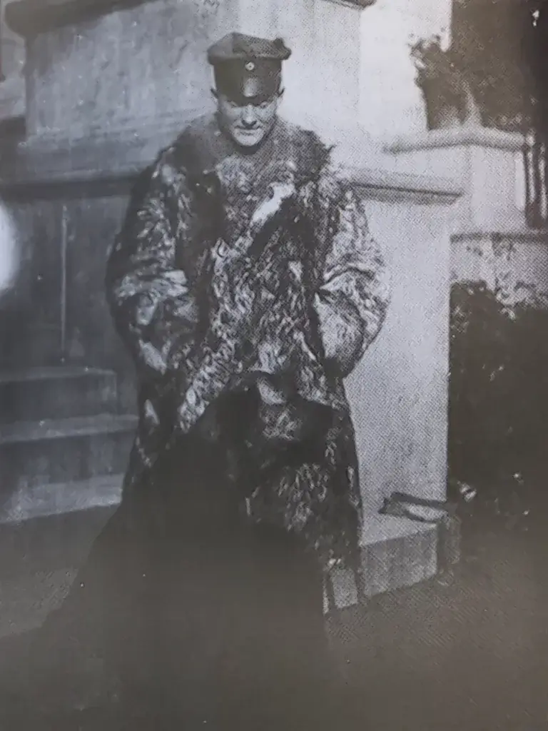 an old black and white photo of a man in a fur coat