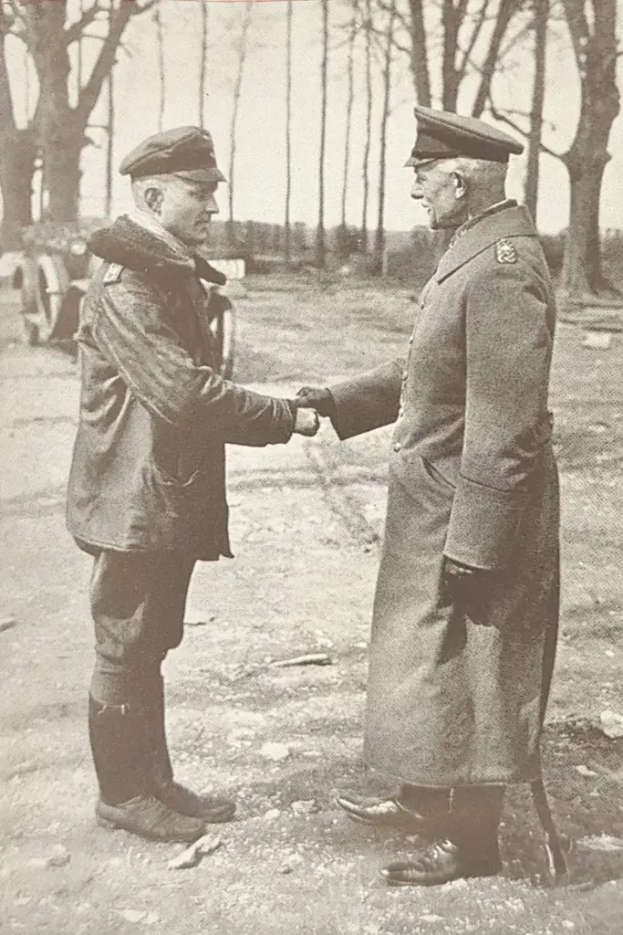 an old photo of two men shaking hands