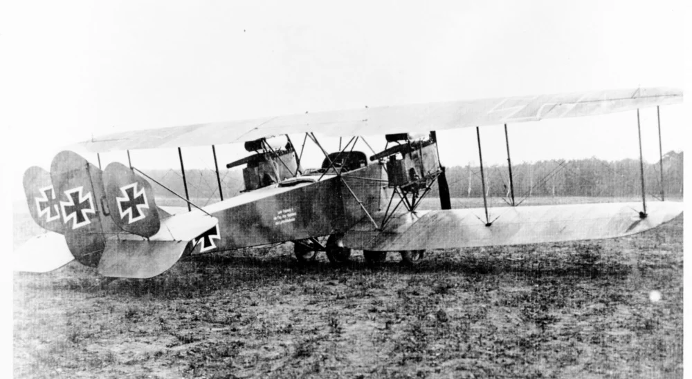 an old airplane is parked on the grass