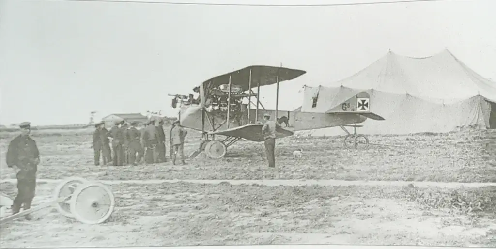 a group of people standing next to an airplane