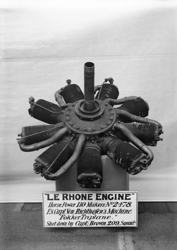 a black and white photo of a machine engine