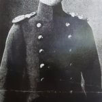 a black and white photo of a man in uniform