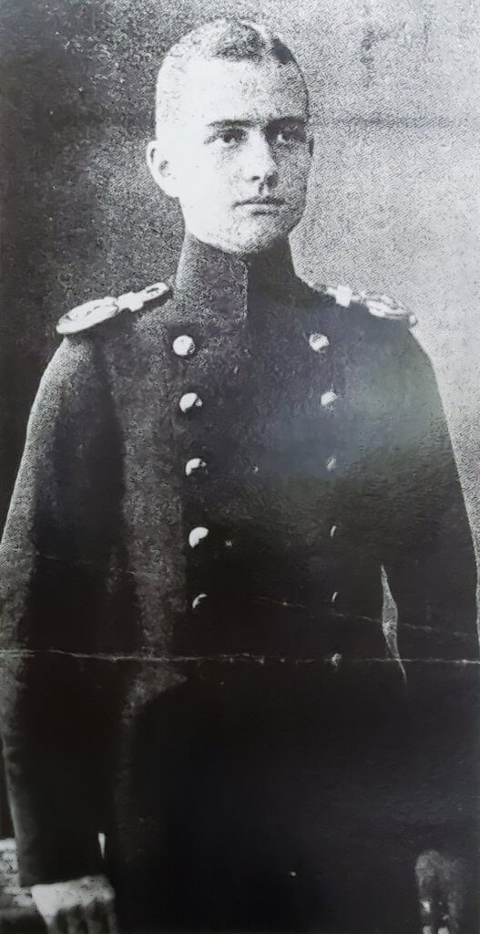 a black and white photo of a man in uniform