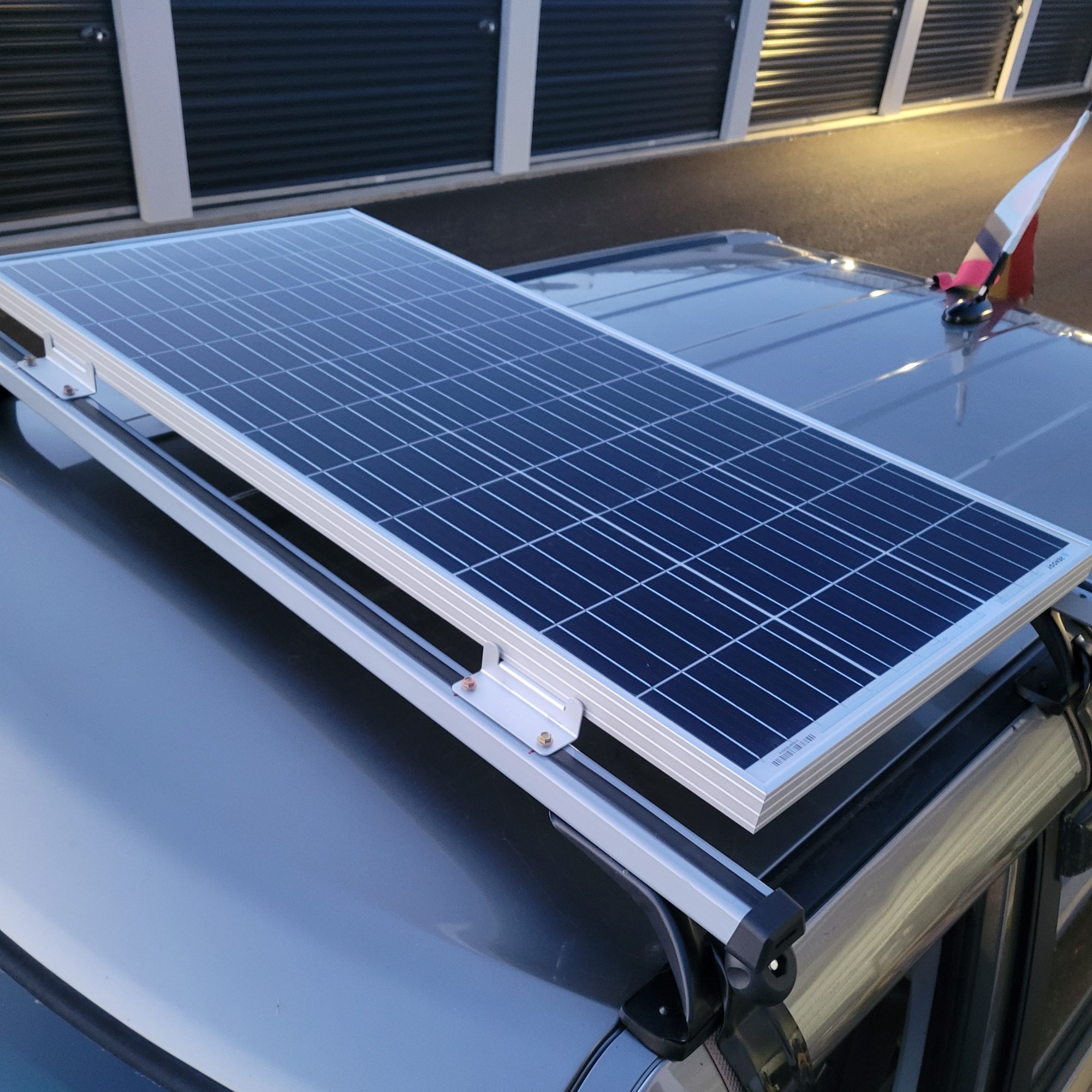 Renogy 100W 12V Monocrystalline Solar Panel Mounted on a 2013 Kia Soul