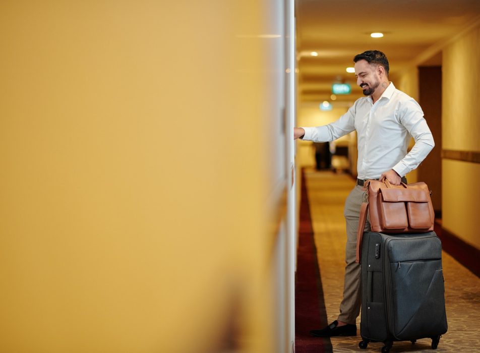 Hotel guest opening room door