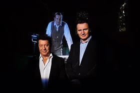 Director Jeff Wayne and actor Liam Neeson pose for a portrait prior to the press conference to announce the 2012 European Tour of Jeff Wayne's musical version of War Of The Worlds New Generation with Liam Neeson and Jeff Wayne, at One Marylebone on November 18, 2011 in London, England.