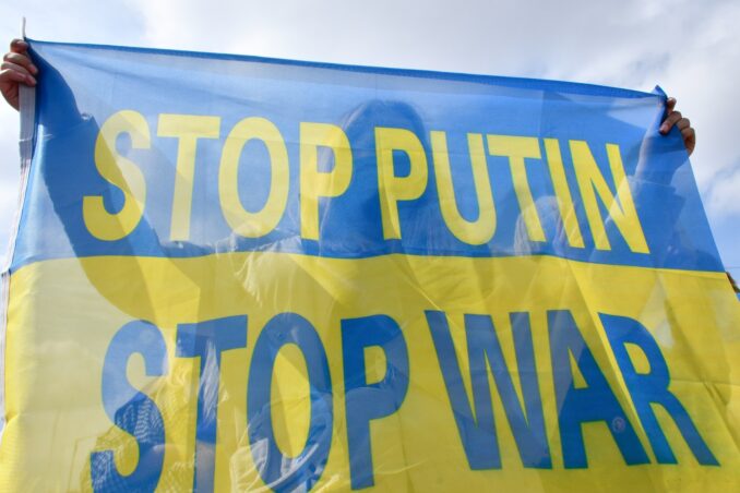 Ukrainian flag with the words "Stop Putin Stop War"