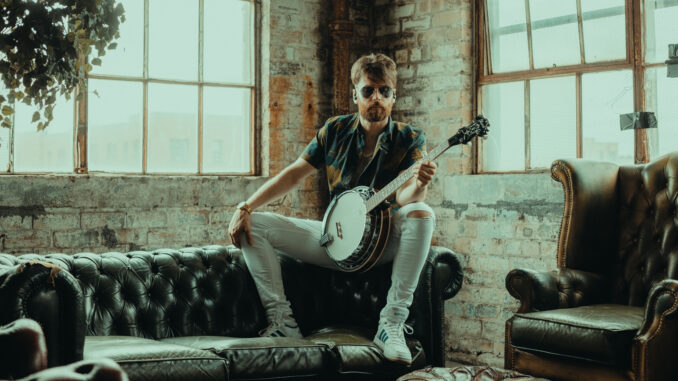 Fraser Edwards playing banjo Fraser Edwards playing banjo