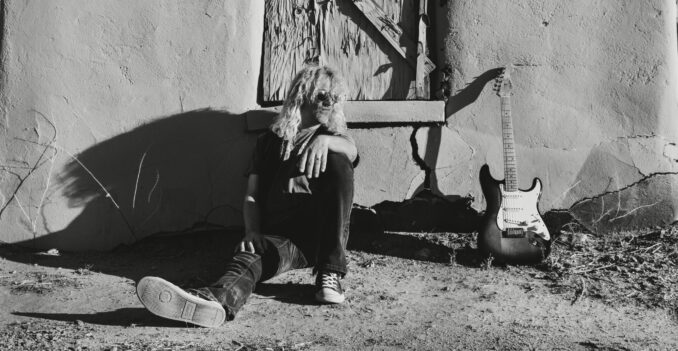 Atomic Kings Ryan McKay from Atomic Kings sitting on the ground.